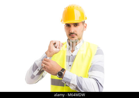 Professional engineer builder dressing or getting ready for work isolated on white background Stock Photo