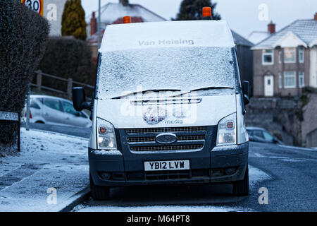 Pictured: A snow covered Virgin internet van called Van Helsing, caused by the 'Beast from the East' has covered parts of Swansea, south Wales, UK. We Stock Photo