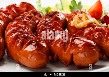 Grilled sausages and vegetables Stock Photo