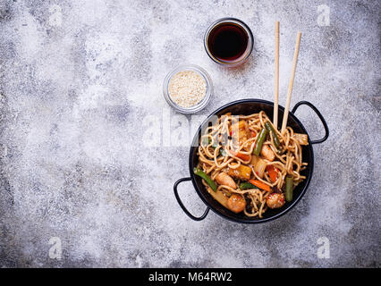 Stir fry noodles with chicken, tofu and vegetable.   Stock Photo