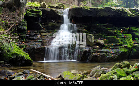 Beautiful waterfall deep in the forest, Poland Stock Photo
