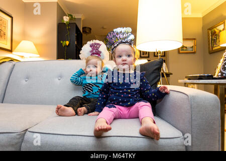 A Caucasian Boy and Girl Enjoy New Years Eve Together in Their Suburban Home Living Room Stock Photo