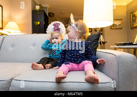 A Caucasian Boy and Girl Enjoy New Years Eve Together in Their Suburban Home Living Room Stock Photo