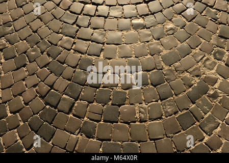 Old pavement road, texture. Texture of stone pavement tiles cobblestones, background, pavement stone. Stock Photo