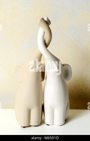 Small beautiful isolated shiny decorative porcelain figure Stock Photo