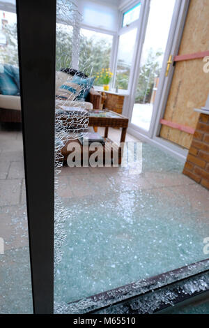 Shattered glass covring floor after burgalry, Stock Photo
