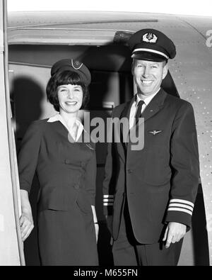 1960s MAN CO-PILOT AND WOMAN FLIGHT ATTENDANT STANDING SMILING IN DOOR OF AIRPLANE LOOKING AT CAMERA - a7297 HAR001 HARS PILOT OLD TIME OLD FASHION AIRCRAFT BOARDING STYLE WELCOME YOUNG ADULT SAFETY TEAMWORK TWO PEOPLE CAUCASIAN PLEASED JOY LIFESTYLE PLANES FEMALES FLIGHT FRIENDSHIP FULL-LENGTH HALF-LENGTH LADIES INSPIRATION CARING COUPLES CONFIDENCE TRANSPORTATION NOSTALGIA TOGETHERNESS EYE CONTACT 25-30 YEARS 30-35 YEARS 35-40 YEARS FREEDOM OCCUPATION PILOTS STEWARD HAPPINESS ADVENTURE STYLES CUSTOMER SERVICE COURAGE AND EXCITEMENT KNOWLEDGE LEADERSHIP PRIDE AVIATION BLOUSE FEMININE SMILES Stock Photo