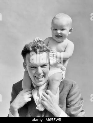 1930s LAUGHING FATHER CARRYING BABY SON ON HIS SHOULDERS AS KID PULLS DAD'S HAIR - b13399 HAR001 HARS SURPRISE OLD FASHION 1 JUVENILE LAUGH BLOND SECURITY YOUNG ADULT BALANCE INFANT TWO PEOPLE CAUCASIAN SONS PLEASED JOY LIFESTYLE HOME LIFE COPY SPACE FULL-LENGTH CARING INDOORS SPIRITUALITY CONFIDENCE NOSTALGIA FATHERS TOGETHERNESS 0-1 YEARS 20-25 YEARS 25-30 YEARS FREEDOM HAPPINESS HEAD AND SHOULDERS CHEERFUL HIS STRENGTH DADS EXCITEMENT SUPPORT GROWTH SMILES JOYFUL BABY BOY 6-12 MONTHS JUVENILES MALES YOUNG ADULT MAN B&W BLACK AND WHITE CAUCASIAN ETHNICITY OLD FASHIONED PERSONS PULLS Stock Photo