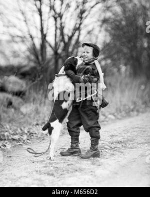 1950s SMILING BOY WEARING WINTER COAT HAT SCARF BOOTS ICE SKATES SLUNG OVER SHOULDER HUGGING ENGLISH SPRINGER SPANIEL DOG - d2400 DEB001 HARS STYLE BLOND BALANCE TEAMWORK CAUCASIAN SPANIEL PLEASED JOY RURAL HEALTHINESS ONE PERSON ONLY HOME LIFE WOOL COPY SPACE FRIENDSHIP FULL-LENGTH PHYSICAL FITNESS CARING ANIMALS SERENITY CONFIDENCE NOSTALGIA TOGETHERNESS 7-9 YEARS ONE ANIMAL 5-6 YEARS PATH HAPPINESS MAMMALS WELLNESS LEISURE RELAXATION CANINES RECREATION SPRINGER GROWTH SMILES TRAIL JOYFUL RESPONSIBILITY CAPS PATHS SLUNG SPRINGER SPANIEL WOOLEN TRAILS CANINE HIND JUVENILES MALES MAMMAL B&W Stock Photo