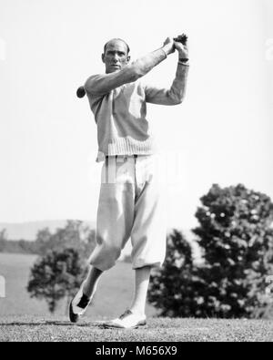 1920s 1930s MAN GOLFER WEARING KNICKERS AND SWEATER SWINGING DRIVER CLUB - g3641 HAR001 HARS HEALTHINESS ONE PERSON ONLY ATHLETICS COPY SPACE FULL-LENGTH PHYSICAL FITNESS GOLFING ATHLETIC PROFESSION NOSTALGIA 30-35 YEARS 35-40 YEARS GOALS ACTIVITY COURSE OCCUPATION PHYSICAL STRENGTHENING WEIGHT LOSS HOBBY LEISURE STYLES TROUSERS SELF ESTEEM CAREERS RECREATION SWINGING MENTAL HEALTH FASHIONS HONING SKILLS ATHLETES FLEXIBILITY MUSCLES CARDIOVASCULAR ENHANCE PLUS FOURS TWO-TONE MALES MID-ADULT MID-ADULT MAN SPECTATOR SHOE TWO TONE AMATEUR B&W BLACK AND WHITE BREECHES CAUCASIAN ETHNICITY Stock Photo