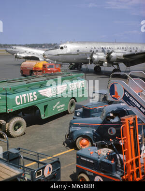 1950s COLONIAL AIRLINES AIRPLANE ON TARMAC WITH GASOLINE TRUCKS IN FOREGROUND LAGUARDIA AIRPORT NEW YORK USA - ka9171 CPC001 HARS EASTER AIRLINES FOREGROUND LADDER TRUCKS LAGUARDIA LUGGAGE VEHICLE MUNICIPAL OLD FASHIONED SERVICE VEHICLES Stock Photo