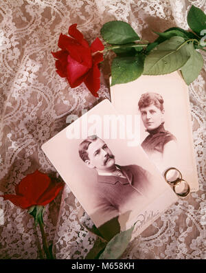 1890s 1900s STILL LIFE OF ANTIQUE PHOTOGRAPHS HUSBAND WIFE COUPLE WITH WEDDING RINGS RED ROSES ON WHITE LACE - kb11286 HAR001 HARS RINGS COPY SPACE LADIES MARRIAGE GROWN-UP 1900s COUPLES INDOORS CEREMONY NOSTALGIA TOGETHERNESS BRIDAL EYE CONTACT 20-25 YEARS 25-30 YEARS 30-35 YEARS 35-40 YEARS PEOPLE STORY WIVES HIGH ANGLE BRIDES TURN OF THE 20TH CENTURY NOBODY 1890s RELATIONSHIPS CONCEPTUAL STILL LIFE RITE OF PASSAGE SMALL GROUP OF OBJECTS WED NEWLYWED MALES MARRY MATRIMONY MID-ADULT MID-ADULT MAN MID-ADULT WOMAN WEDDING BAND WEDDING RING WEDLOCK CARTE DE VISITE CARTE-DE-VISITE Stock Photo