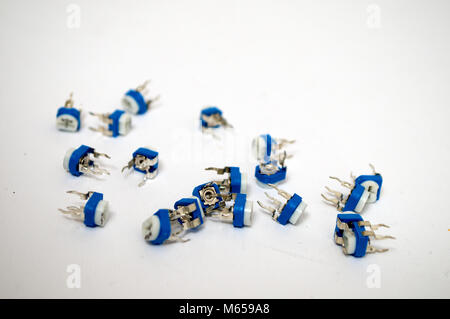 A bunch of white blue potentiometer on a white background Stock Photo