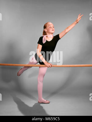 1960s YOUNG BLOND GIRL BALLET DANCER STRETCHING EXERCISING AT PRACTICE BALANCE BARRE - kd1717 HAR001 HARS ONE PERSON ONLY COPY SPACE FULL-LENGTH PHYSICAL FITNESS PRACTICE ATHLETIC INDOORS ENTERTAINMENT NOSTALGIA 10-12 YEARS GOALS STABILITY SINGLE OBJECT YOUNGSTER ACTIVITY DREAMS PHYSICAL STRENGTHENING WEIGHT LOSS WELLNESS SELF ESTEEM POSTURE RECREATION BALLERINA GROWTH MENTAL HEALTH HONING SKILLS COOPERATION GOOD HEALTH FLEXIBILITY LEOTARD MUSCLES CARDIOVASCULAR ENHANCE JUVENILES PRE-TEEN PRE-TEEN GIRL BARRE CAUCASIAN ETHNICITY GRACEFUL IMPROVED STRENGTH MUSCLE DEFINITION OLD FASHIONED PERSONS Stock Photo