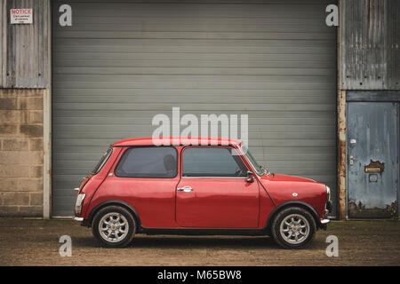 Classic British mini car side view isolated on white Stock Photo - Alamy