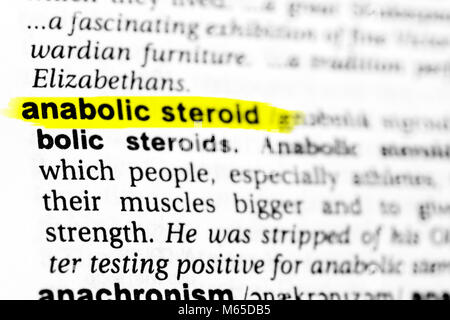 Highlighted English word 'anabolic steroid' and its definition in the dictionary. Stock Photo