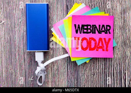 Webinar Today. Business concept for Online Education Event written on sticky note with space on old wood wooden background with power bank Stock Photo