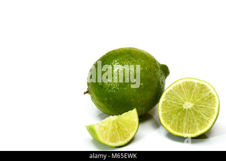 Studio shot image of juicy organic ripe limes isolated on a white background Stock Photo