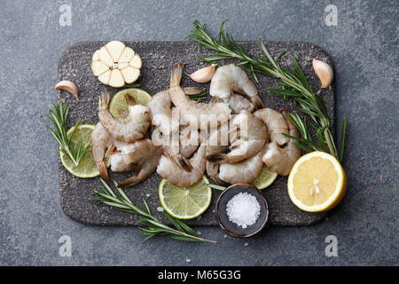 Cooking raw tiger prawns with herbs and spices Stock Photo