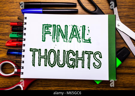 Conceptual hand writing text Final Thoughts.  Concept for Conclusion Summary Text Written on notebook, wooden background office equipment like pens sc Stock Photo