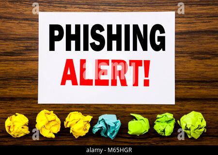 Hand writing text caption inspiration showing Phishing Alert. Concept for Fraud Warning Danger Written on sticky, with sticky, one folded paper alone  Stock Photo