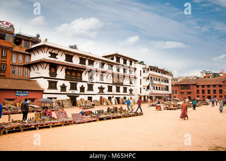 KATHMANDU, NEPAL-MAY 18: Crowd of local Nepalese people visit the famous Durbar square on May 18, 2013 in Kathmandu, Nepal. Bhaktapur is the third lar Stock Photo