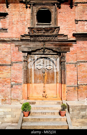 Carved wooden door on Hanuman Dhoka, old Royal Palace, Durbar Square in Kathmandu,  Nepal. Stock Photo