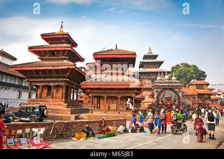 KATHMANDU, NEPAL-MAY 19: Crowd of local Nepalese people visit the famous Durbar square on May 19, 2013 in Kathmandu, Nepal. Bhaktapur is the third lar Stock Photo