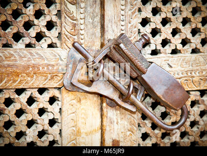 Ornament vintage metal lock on wooden door, Kathmandu.Nepal. Stock Photo