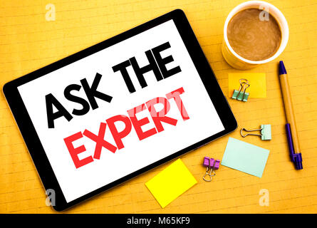 Conceptual hand writing text caption showing Ask The Expert. Business concept for Advice Help Question Written on tablet, wooden background with stick Stock Photo