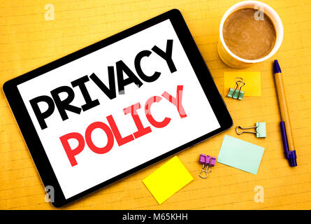 Conceptual hand writing text caption showing Privacy Policy. Business concept for Safety Data Rules Written on tablet, wooden background with sticky n Stock Photo