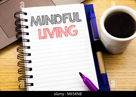 Word, writing Mindful Living. Business concept for Life Happy Awareness written on notebook book on wooden background in the Office with laptop coffee Stock Photo
