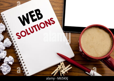 Conceptual hand writing text caption inspiration showing Web Solutions. Business concept for Internet Design Plan written on notepad paper on the wood Stock Photo