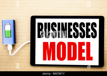 Handwriting Announcement text showing Businesses Model. Business concept for Project For Business Written on tablet with white background charger powe Stock Photo