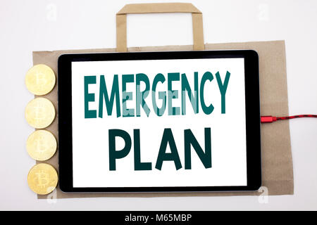 Handwritten text showing Emergency Plan. Business concept writing for Disaster Protection Written on shopping bag and tablet white background, tablet  Stock Photo