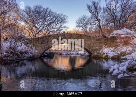 New York, NY USA - Dec 10, 2017. Winter scene of Gapstow Bridge in Central Park NY. Tree branches coverd with white snow. Stock Photo