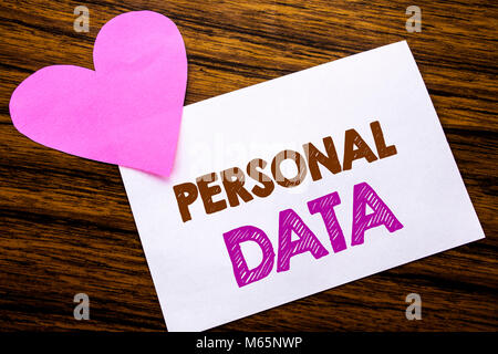 Conceptual hand writing text showing Personal Data. Concept for Digital Protection written on sticky note paper, wooden background. With pink heart me Stock Photo