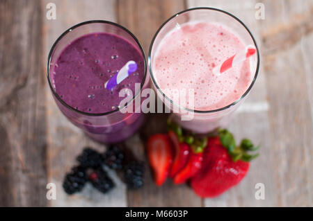 Healthy Eating. Berry smoothies, milkshakes made with fresh blueberries and strawberries in a glass Stock Photo