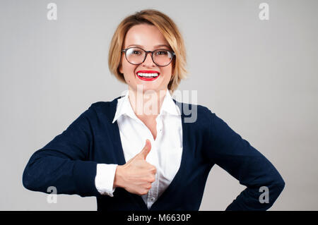 Young happy woman showing thumb up. Like. Business woman with thumb up Stock Photo