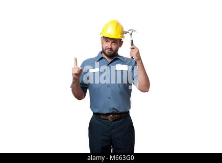 Contractor. Man in uniform and yellow helmet with hammer Stock Photo