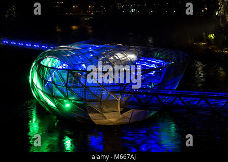 Graz, Austria - 08.02.2018: Blue and green light on the Murinsel on the river Mur Stock Photo