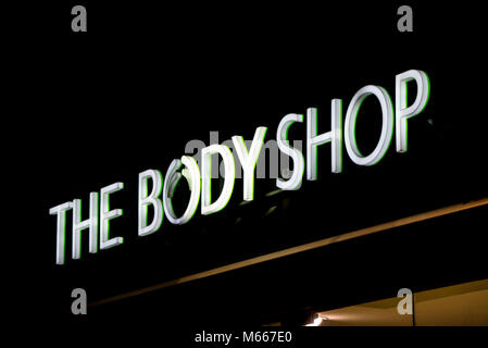 Graz, Austria - 08.02.2018: The Body Shop logo lit up at night above the Graz branch Stock Photo