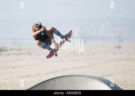 A skateboarder performing tricks at Venice Beach Skatepark, Santa Monica, California, Stock Photo
