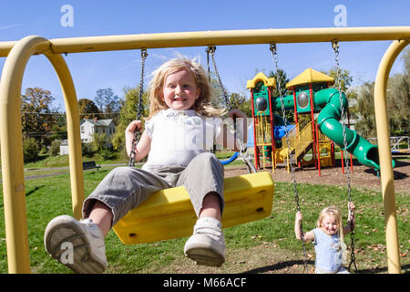 West Virginia,Appalachia Greenbrier County,Ronceverte,playground,child,children,adventure,girls,twins,swings,WV0410080016 Stock Photo
