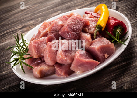 Raw pork on wooden table Stock Photo