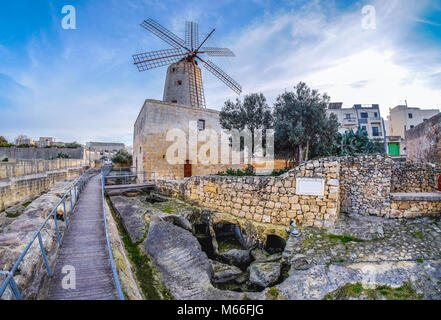 Old traditional windmill in Malta. Now an important tourist attraction. Abandoned structure. Stock Photo