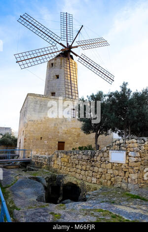Old traditional windmill in Malta. Now an important tourist attraction. Abandoned structure. Stock Photo