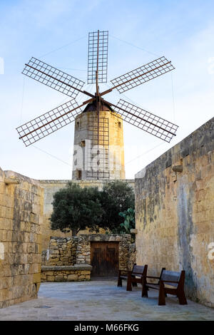 Old traditional windmill in Malta. Now an important tourist attraction. Abandoned structure. Stock Photo