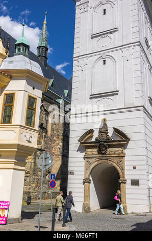 Klatovy, Czech Republic - Street scene in front of the White Tower, the bell tower of the Archdean parish church of the Nativity of Virgin Mary. Stock Photo