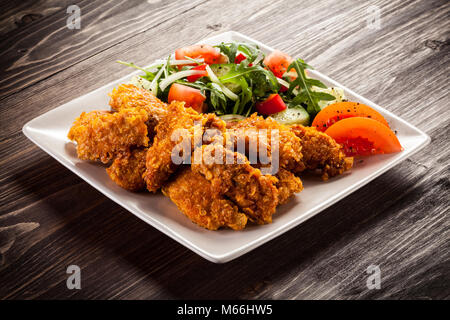 Fried chicken nuggets and vegetables Stock Photo